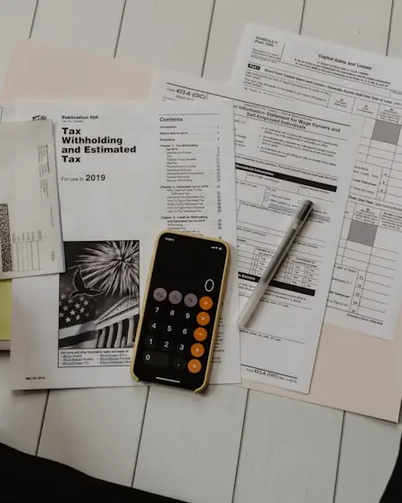 Working through loan payoff paperwork with a calculator